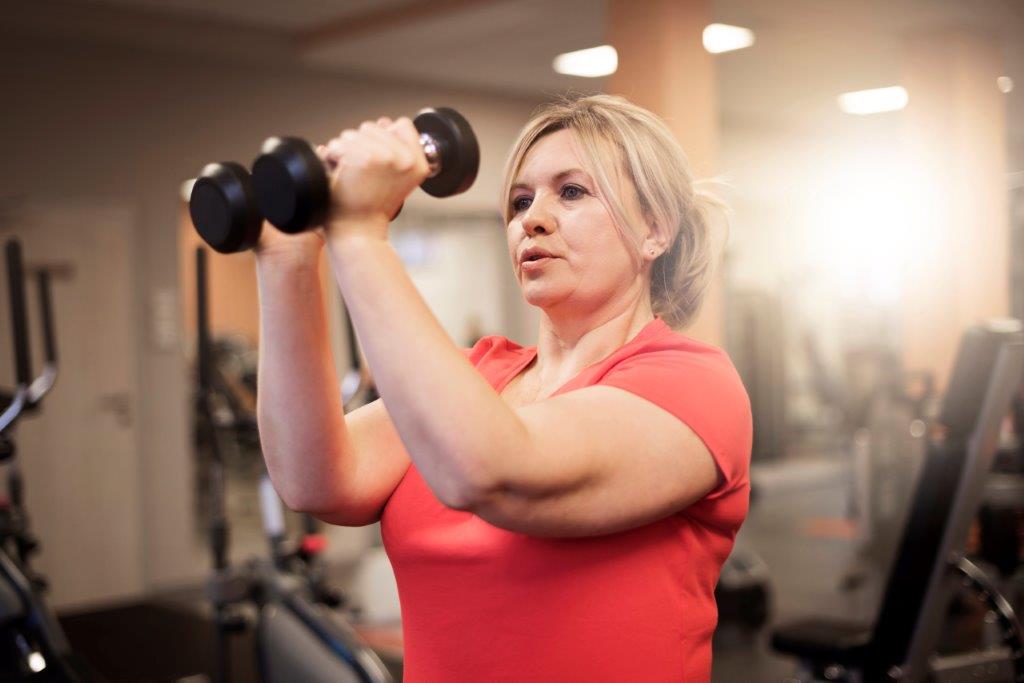 Mature Lady Shoulders Dumbells