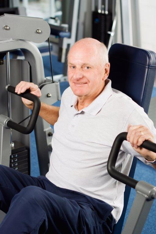 Senior Guy Seated Bench Press Machine