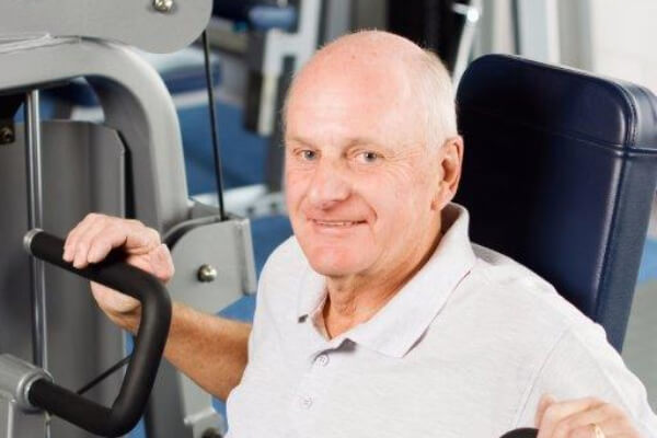 Senior Guy Seated Bench Press Machine