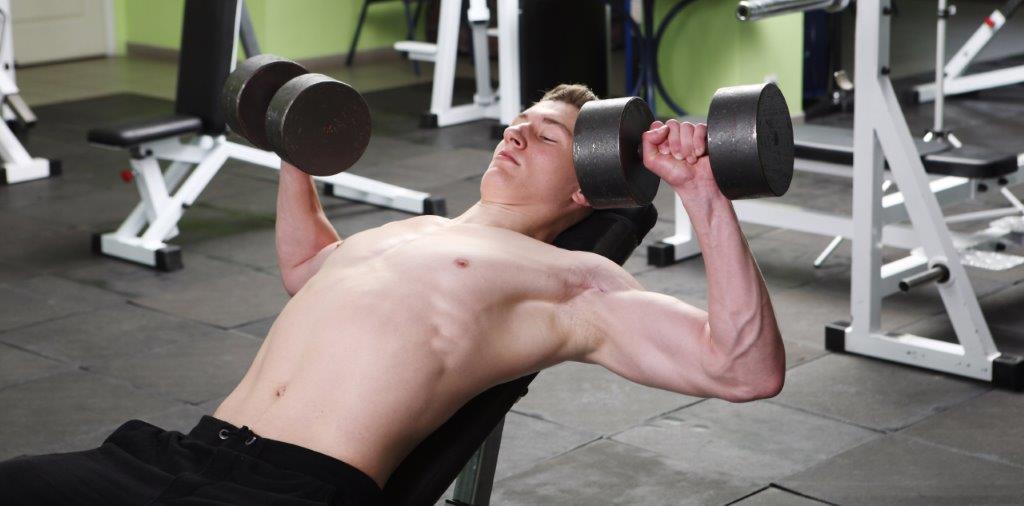 Young Guy Incline Dumbells