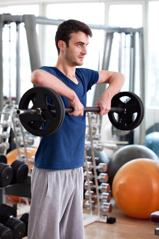 Young Man Barbell Shoulder Uprights